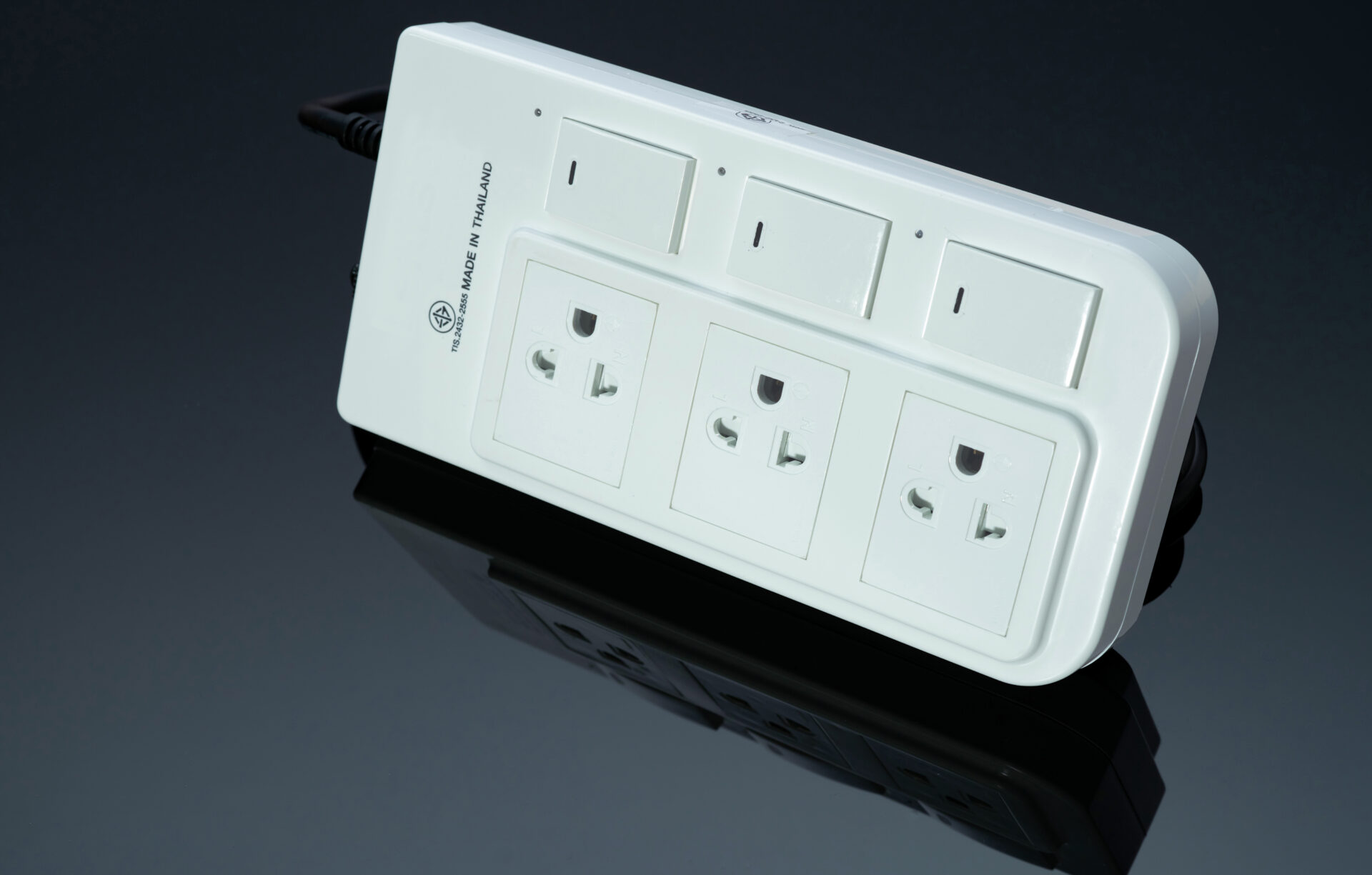 Power strip with three electrical standard socket on black background-Electrical surges-electricians in loveland co
